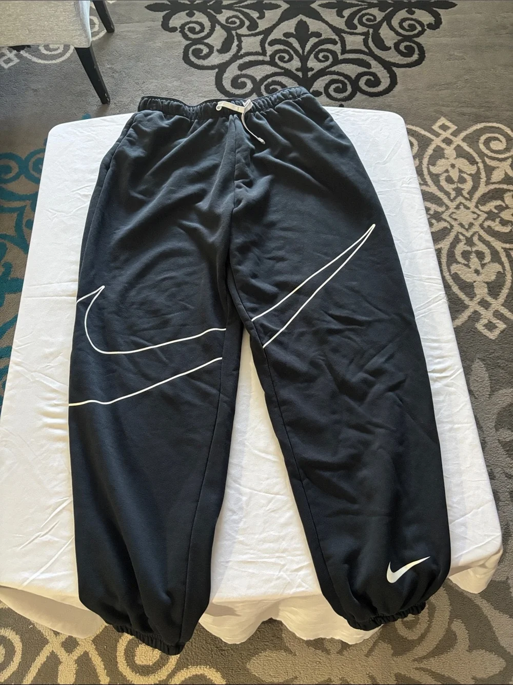 Nike Black Jogger Sweatpants with White Swoosh Graphics